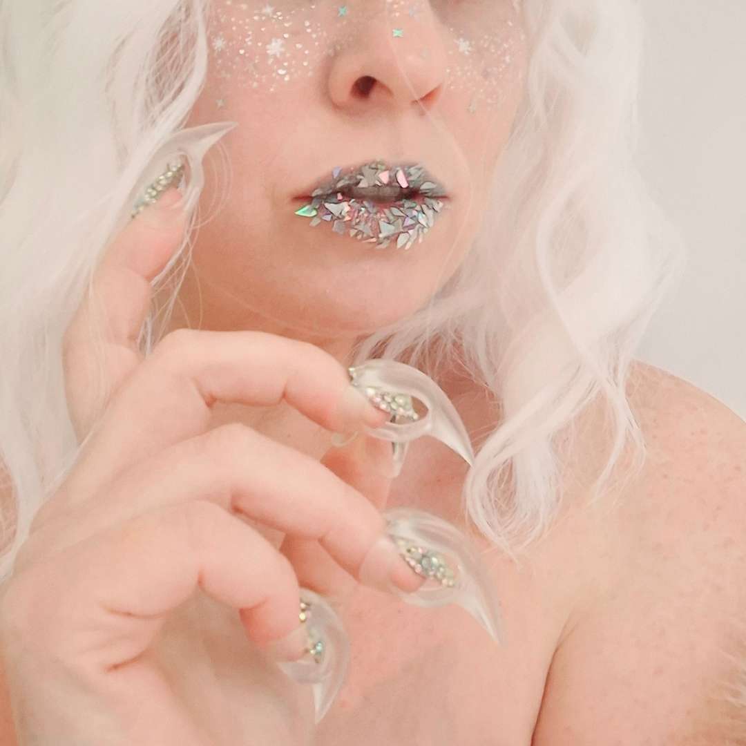 Lifestyle image of beautiful woman wearing Clear sensual play claws