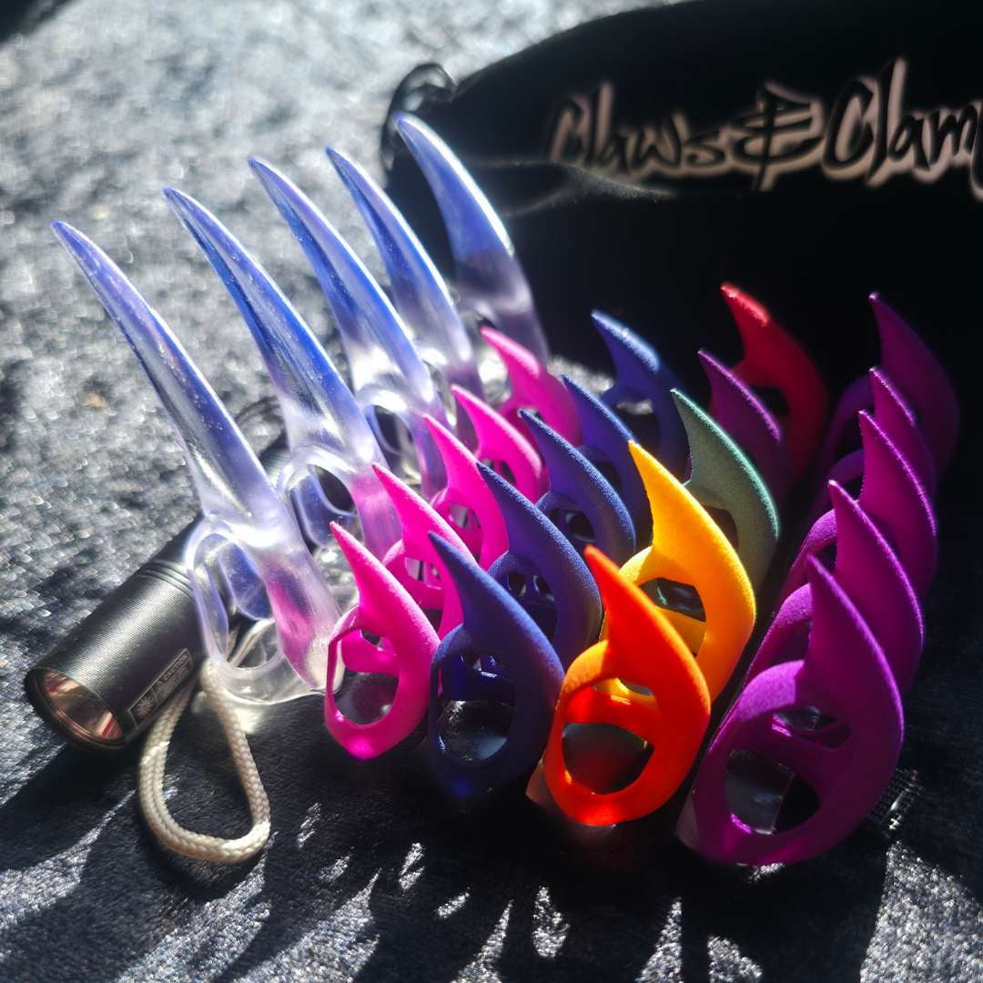 Wide selection of colorful Claws for sensual play, along with a UV bage to light them up under ultraviolet light and a velvet bag to keep it all in