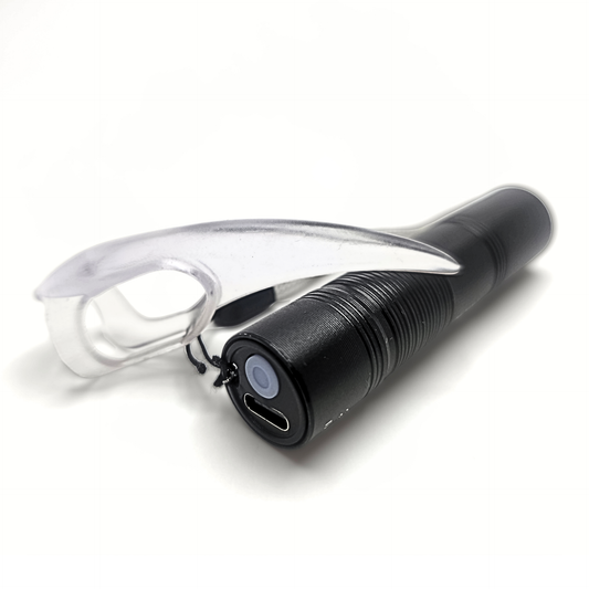 UV Torch for kink play shown with UV reactive BDSM Claw for scale. USB charging