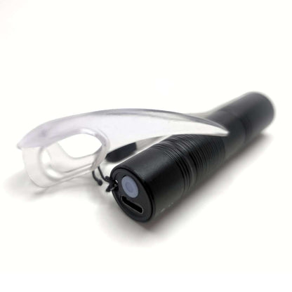 UV Torch for kink play shown with UV reactive BDSM Claw for scale.
