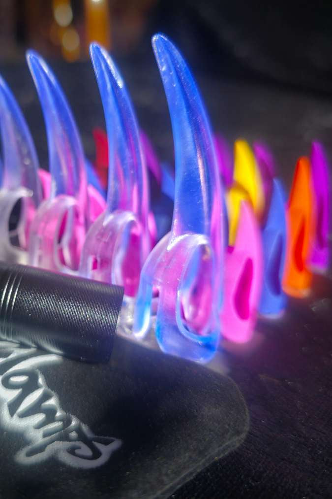 Colorful Claws for sensual adult play, showing a full set of the contents of this players pack bundle deal, includes a branded velvet bag for storage and a UV torch to light up the glowing crystal claws