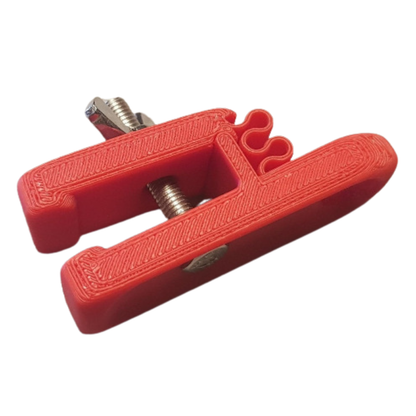 Red Scrotum Clamp - open jaw detail view