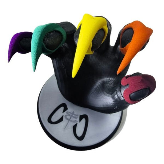 Kitten Pride Claws - Premium Nylon - Claws and Clamps - Kitten Pride Claws - Premium Nylon - Claws and Clamps - Kitten Pride BDSM Claws. Product shot of 5 different colored Claws on a black hand model.